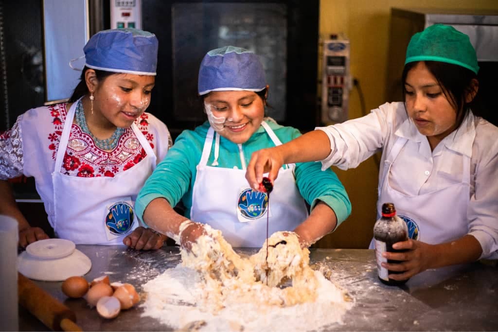 Children mix dough