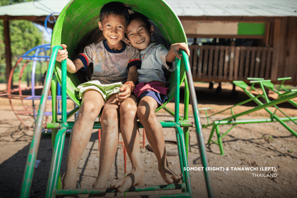 Somdet and Tanawchi in a playground in Thailand